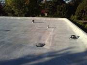 Section of roof top coated with granules (notice the overflow drain).