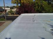 Section of roof that has been base coated.